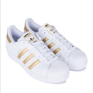 White and gold adidas superstar
